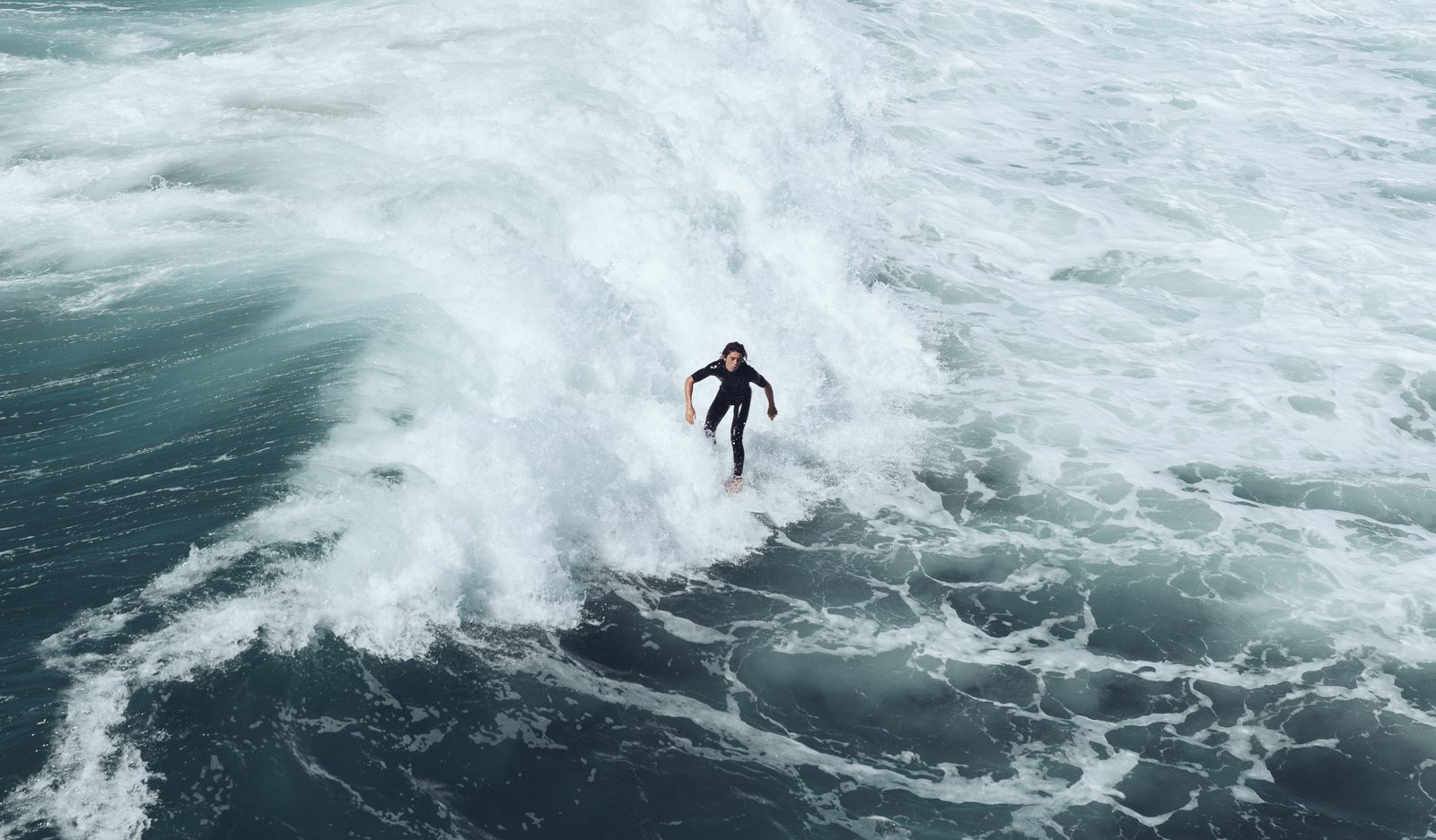 Surf breaks off Huntington Beach. Waves at the beach were running roughly 4 to 6 feet Wednesday as Hurricane Rachel turned back toward the coast.
