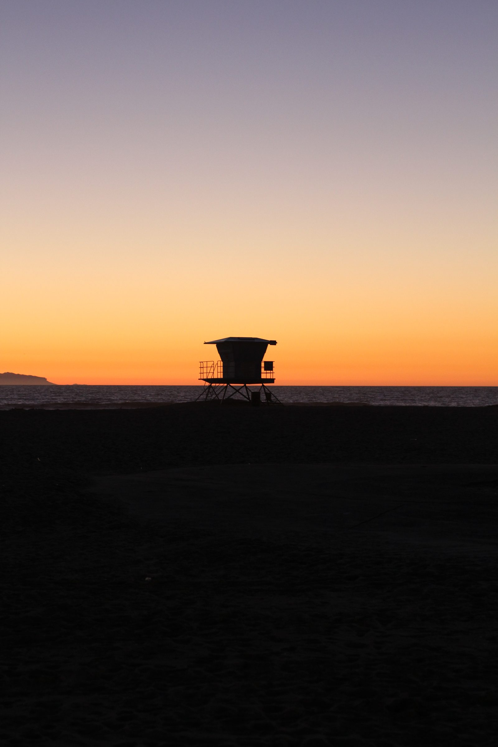 A lifeguard tower on Huntington Beach at sunset. The National Hurricane Center warned that Rachel-generated swells would bring life-threatening surf and rip currents through the weekend.