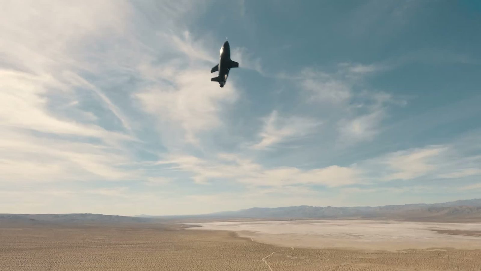A Mach Industries unmanned system in flight over a desert lakebed, in imagery from the company. Kirkman will lead financial strategy and capital markets work as production scales.