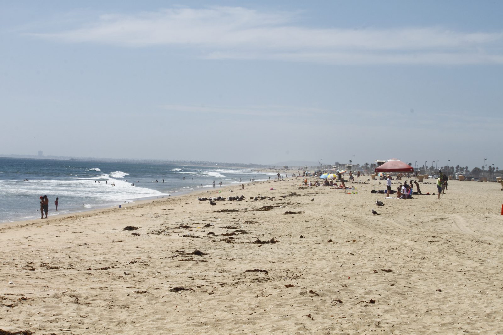 Beachgoers at Bolsa Chica State Beach. The heaviest rain from Post-Tropical Cyclone Rachel is expected late Saturday night into Sunday morning, with coastal areas getting about an inch or less.