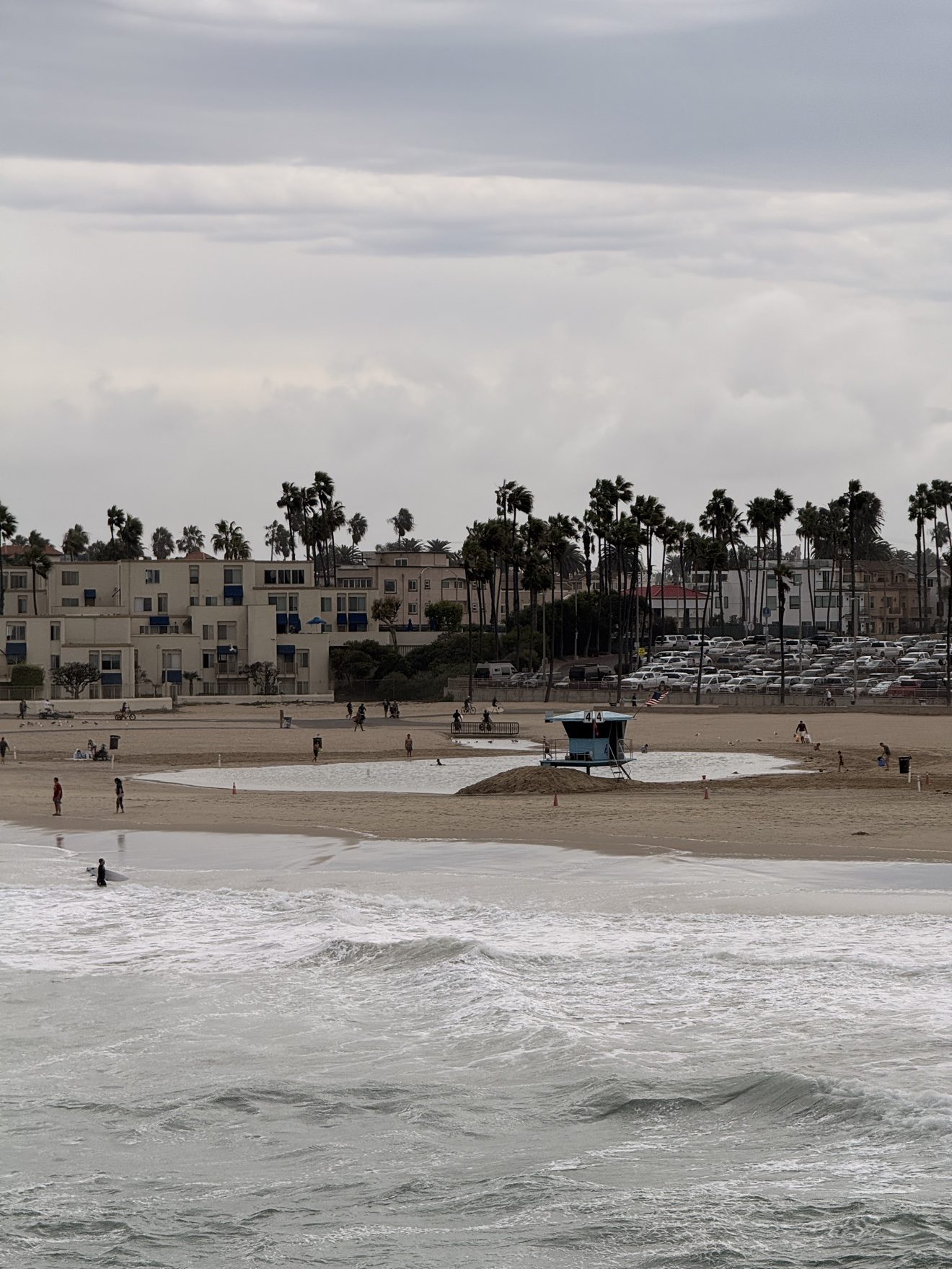 Churning surf breaks near lifeguard tower 44 on Saturday morning, Oct. 10, 2026. The National Weather Service rates the rip current risk as high through the weekend.
