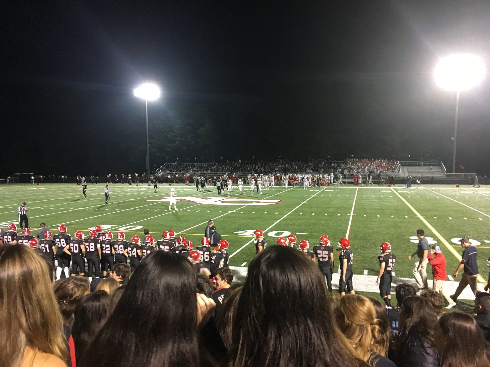 File photo: Friday night football under the lights at New Canaan High School in Connecticut. In Huntington Beach, Edison beat Los Alamitos 27-7 at Cap Sheue Field on Friday night.