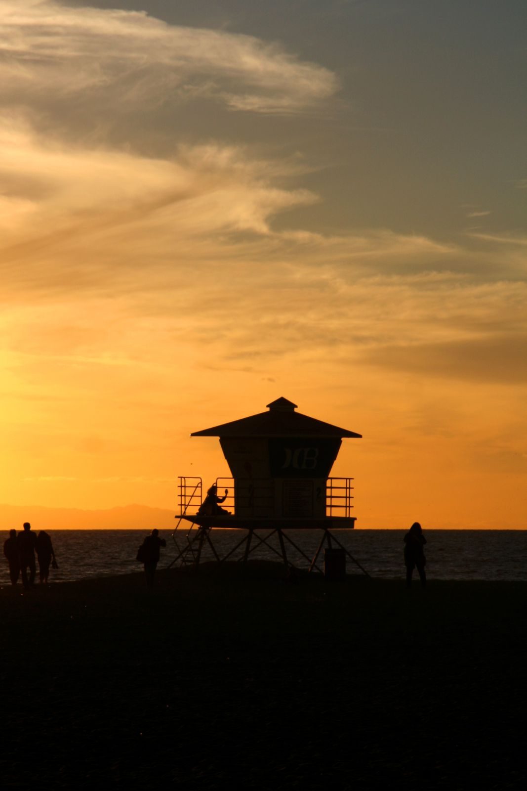 A lifeguard tower at Huntington Beach at sunset. Huntington Beach's Local Coastal Program was effectively certified in March 1985.