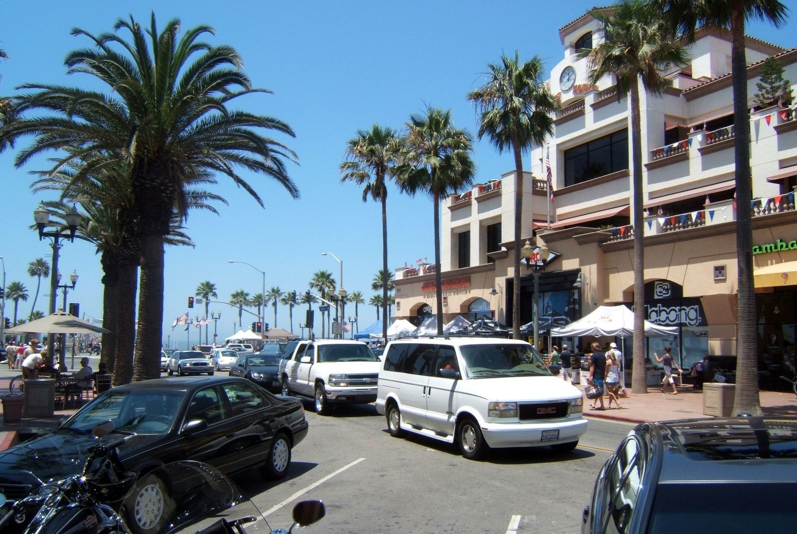 A downtown street leading to the pier. Downtown is the heart of Surf City: Main Street, the pier and walkable streets.